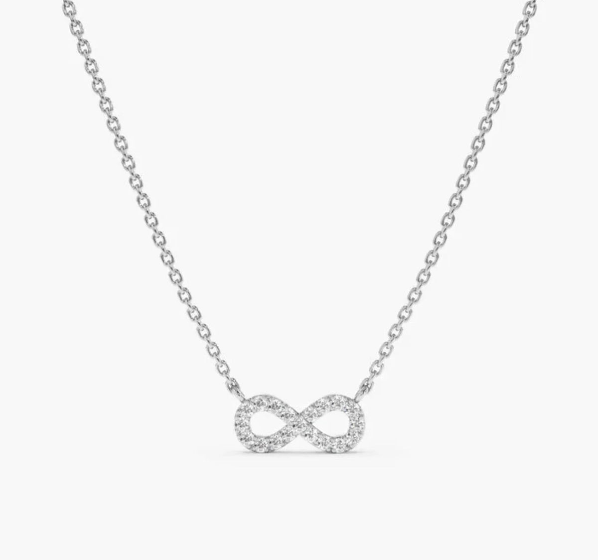 925 sterling silver necklace with cubic zirconia infinity pendant on plain background