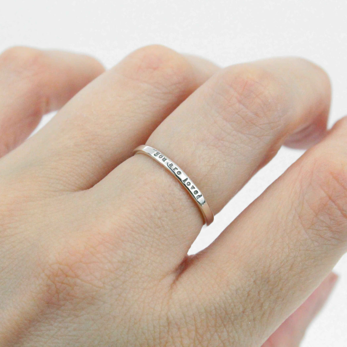 You are loved   tiny message ring in sterling silver